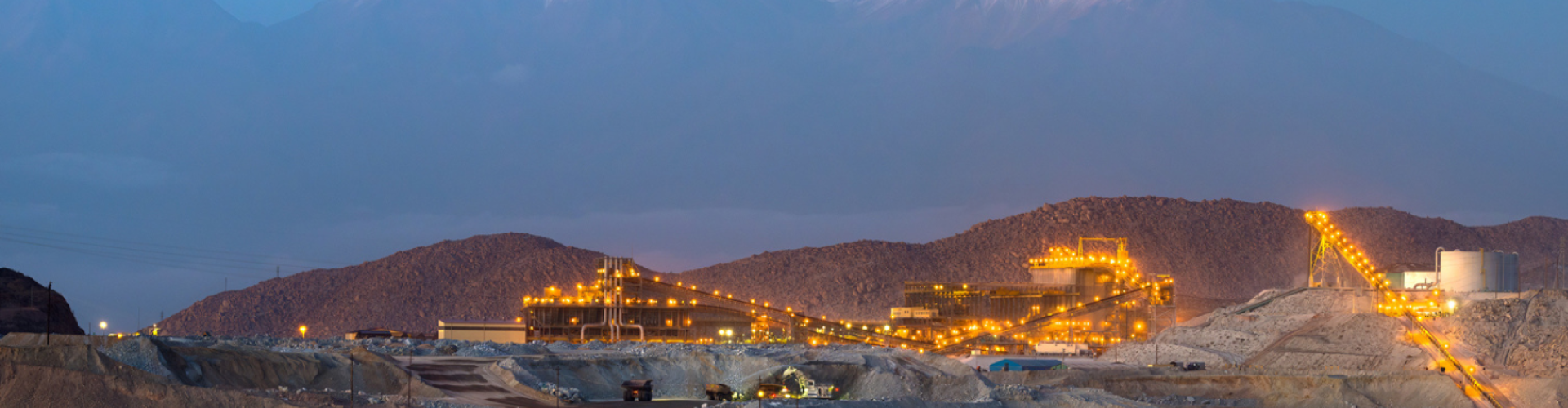 nighttime view of mine with mountains in the background