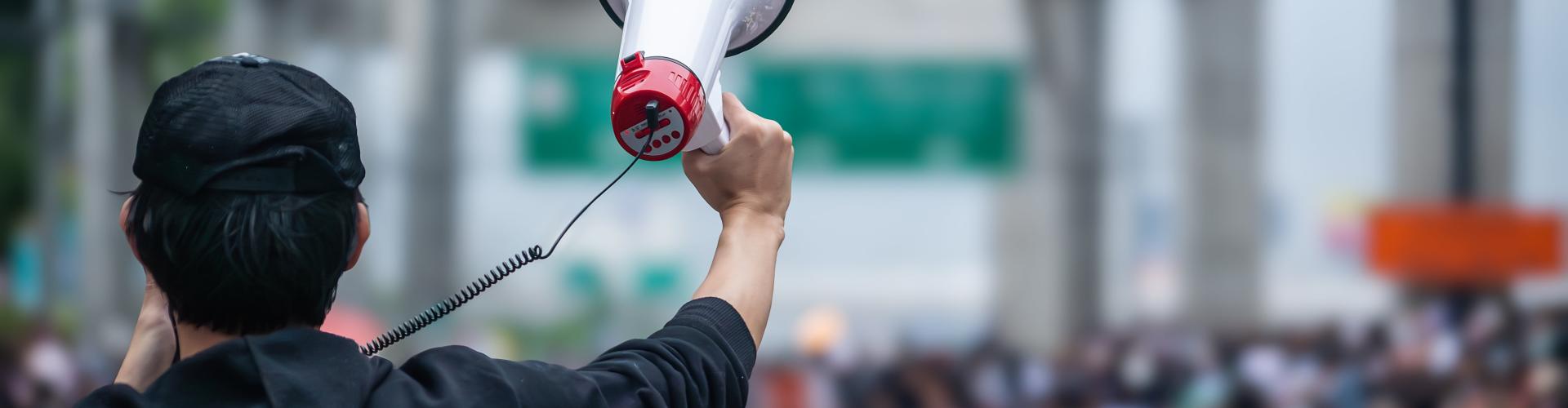 Person holding a megaphone