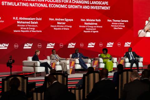 Panelists at Africa Oil Week sitting on stage