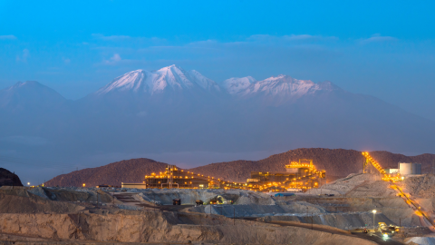 Mine with mountains in the background at night