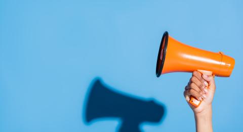 Person holding megaphone