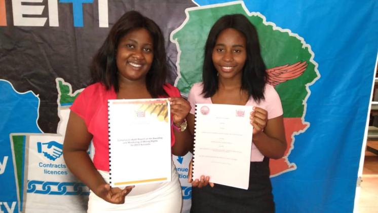 ZEITI staff members posing with the mining licensing audit report in March 2020